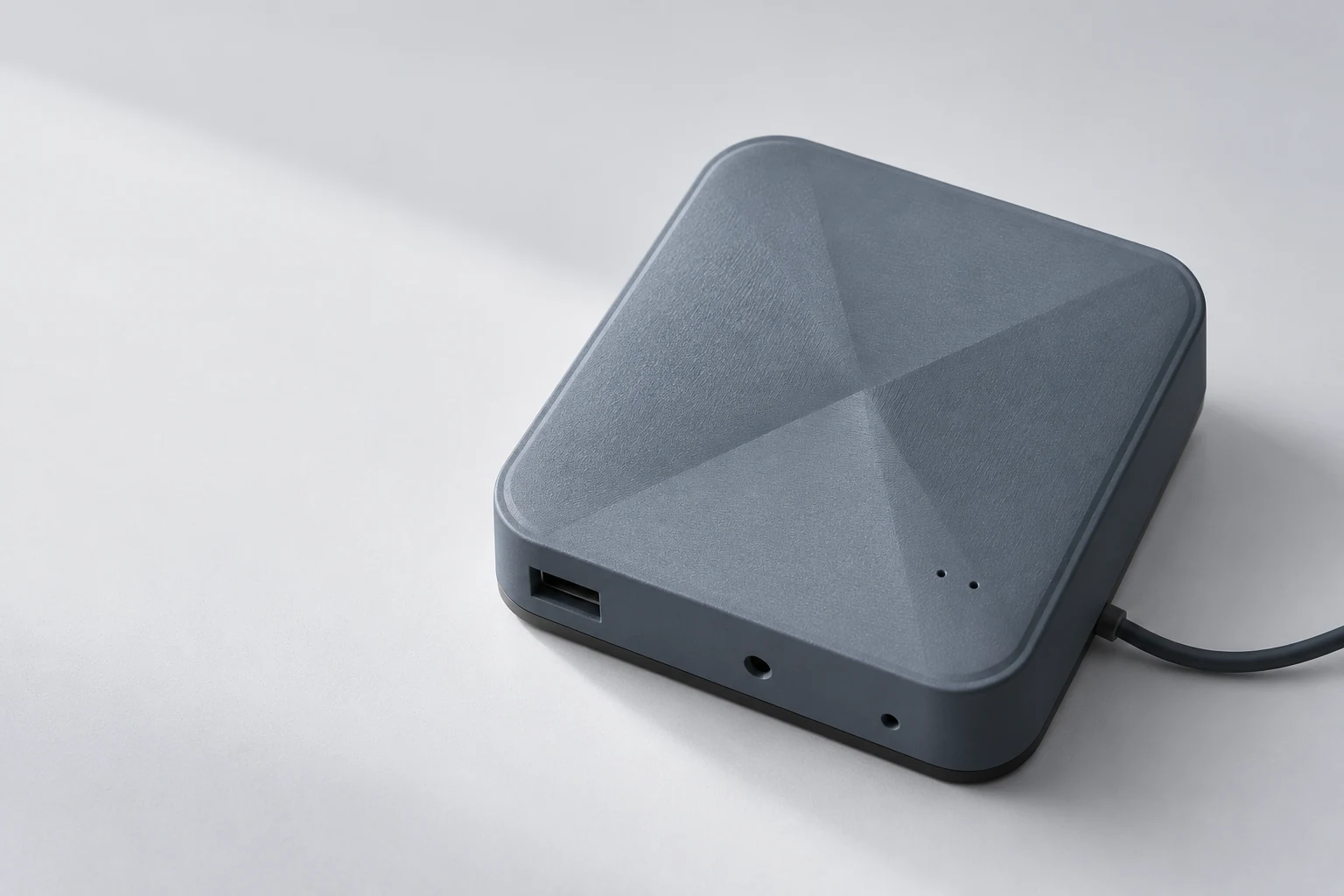 Dune’s compact slate-grey enclosure with its sculpted diagonal face